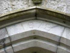 Inscription over the doorway in St Mary's Church, Carrickerry