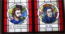 Stained glass window of St Bartholomew and St Ita