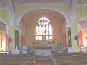 High Altar and stained glass windows.
