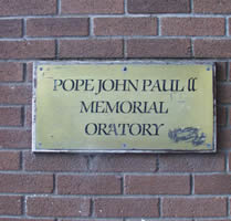 Plaques on the wall of Dooradoyle Oratory